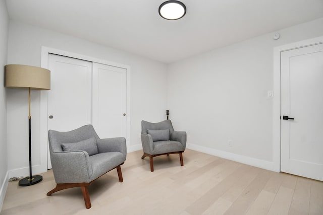 sitting room with light wood-type flooring