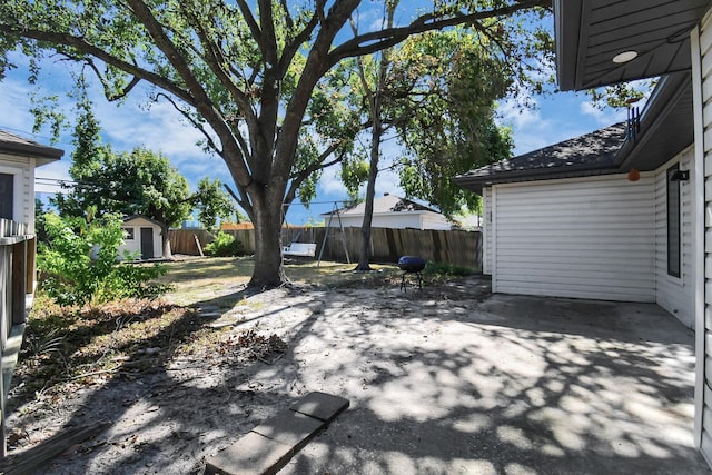 view of patio / terrace featuring a storage unit