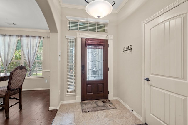 entrance foyer featuring crown molding