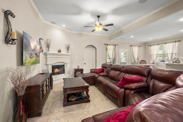 living room featuring ceiling fan and ornamental molding