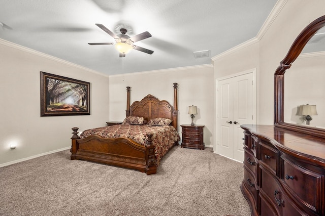 carpeted bedroom with a closet, ceiling fan, and ornamental molding