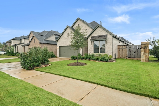 view of front of property featuring a garage and a front yard