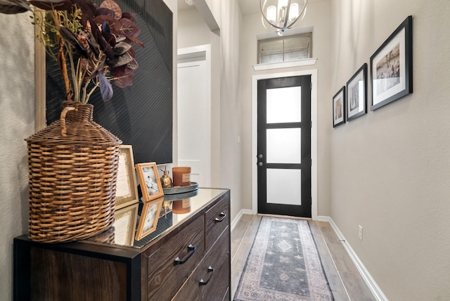 foyer with an inviting chandelier