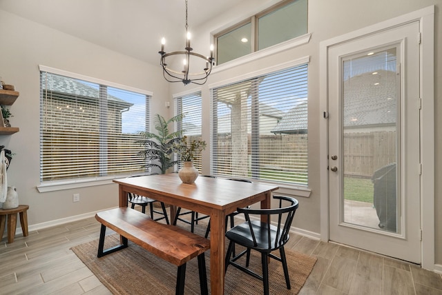 dining space featuring a chandelier and plenty of natural light