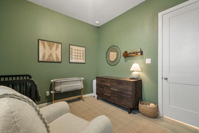 bedroom featuring a crib