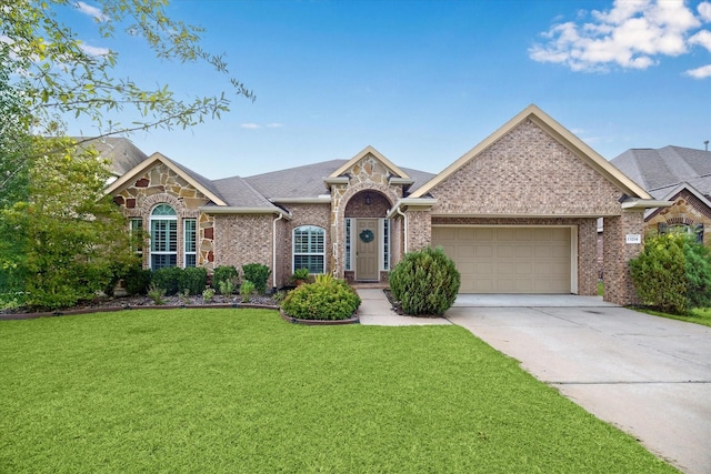 ranch-style home featuring a garage and a front lawn