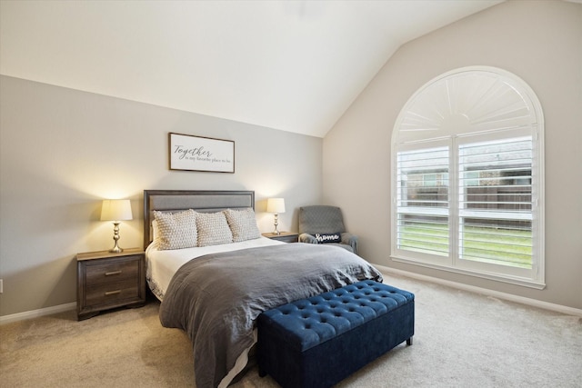 carpeted bedroom with vaulted ceiling