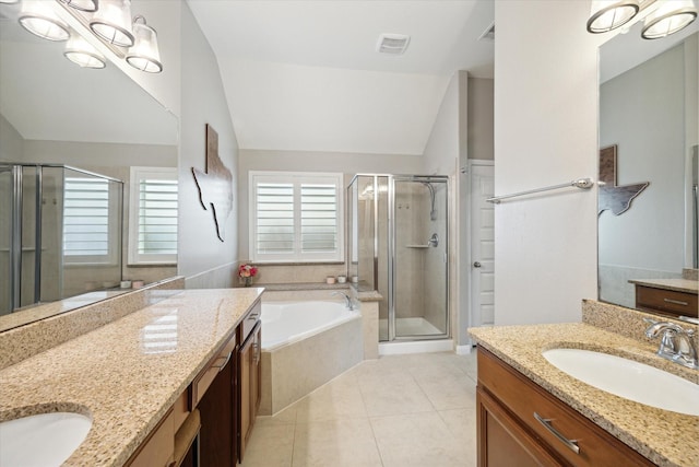 bathroom featuring tile patterned floors, vanity, plus walk in shower, and vaulted ceiling