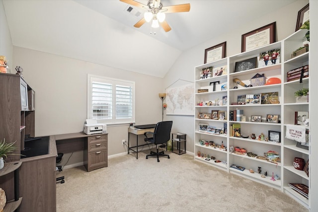 carpeted home office with ceiling fan and vaulted ceiling