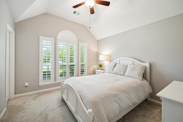 bedroom featuring ceiling fan, lofted ceiling, and light carpet