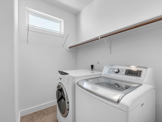 laundry room featuring separate washer and dryer