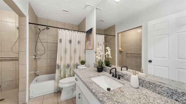 full bathroom with tile patterned floors, vanity, shower / bath combination with curtain, and toilet