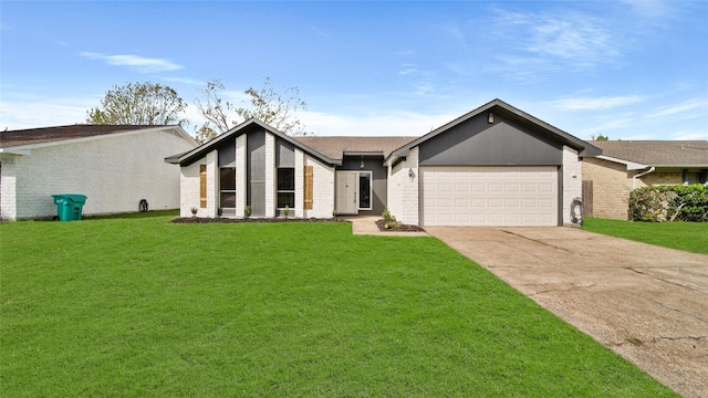 view of front of property with a front yard and a garage