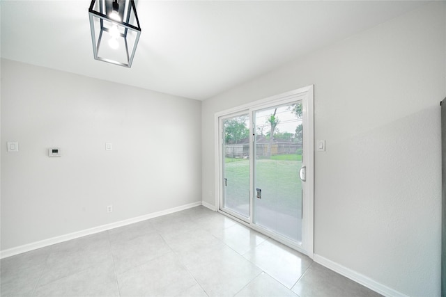 empty room featuring light tile patterned floors