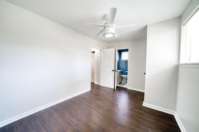 spare room featuring ceiling fan and dark hardwood / wood-style flooring