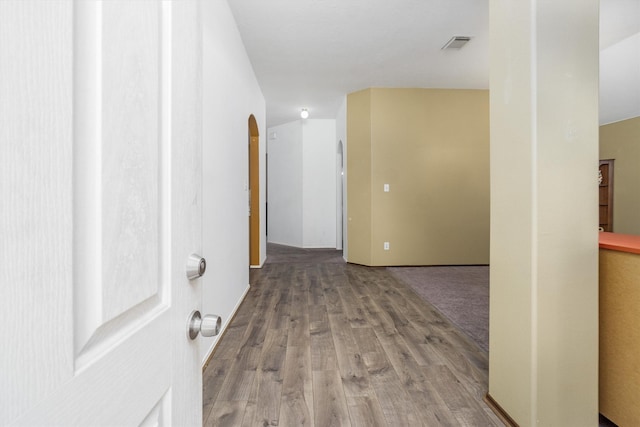 hallway with hardwood / wood-style flooring