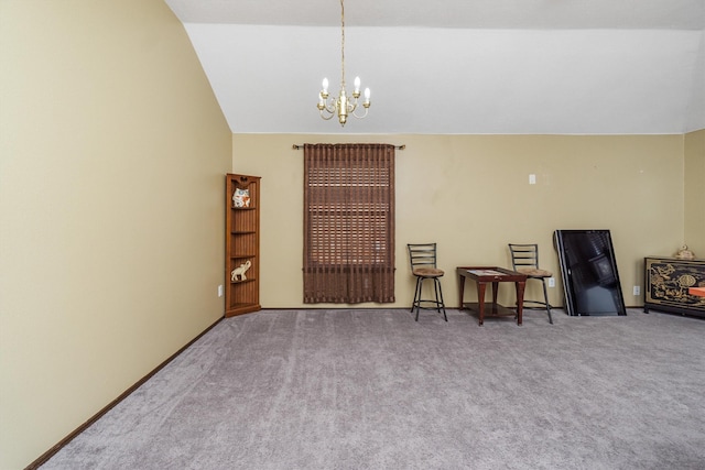 sitting room with carpet, lofted ceiling, and a notable chandelier