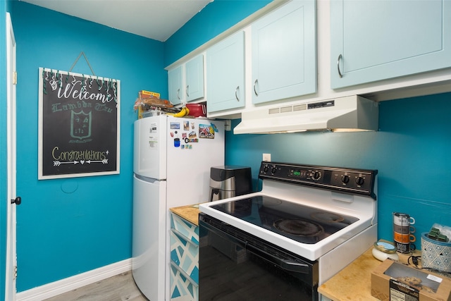 kitchen with white cabinets, white fridge, light hardwood / wood-style flooring, and range with electric stovetop