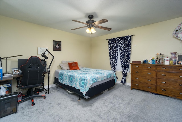 bedroom featuring light colored carpet and ceiling fan