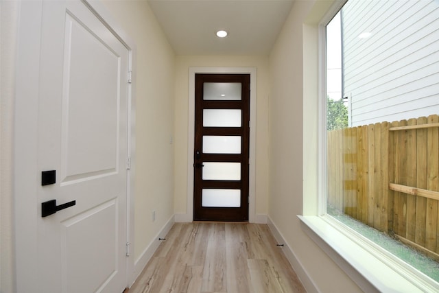 doorway to outside with light hardwood / wood-style flooring