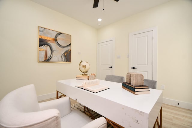 office space featuring ceiling fan and light wood-type flooring