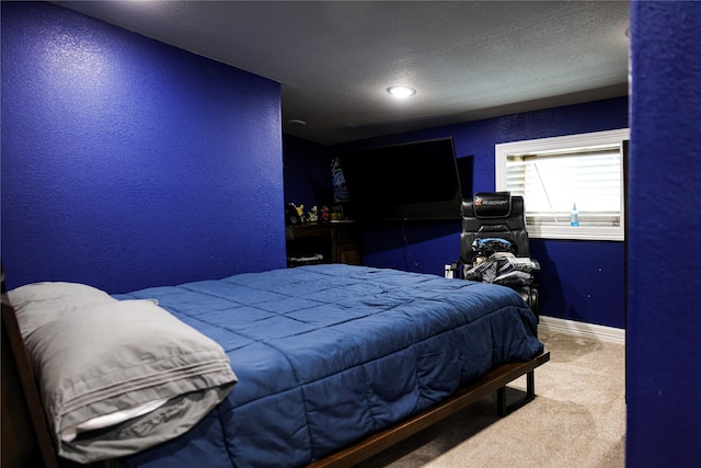 carpeted bedroom featuring a textured ceiling