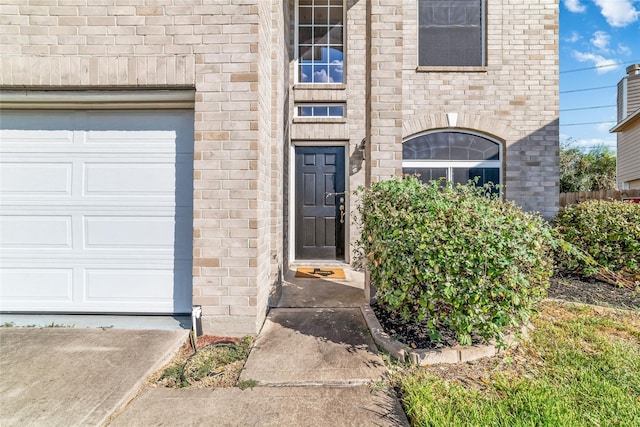 property entrance with a garage