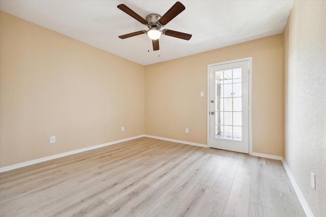 unfurnished room with ceiling fan and light hardwood / wood-style flooring