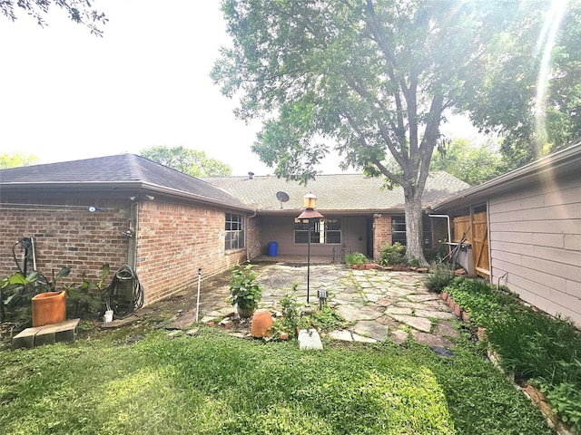 rear view of house with a patio