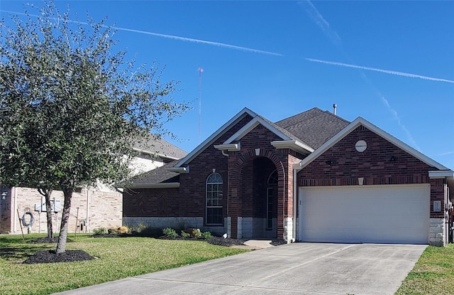 view of front facade with a front lawn and a garage