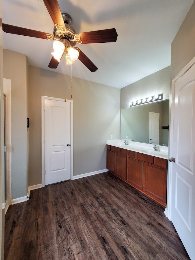 bathroom featuring ceiling fan, hardwood / wood-style floors, and vanity