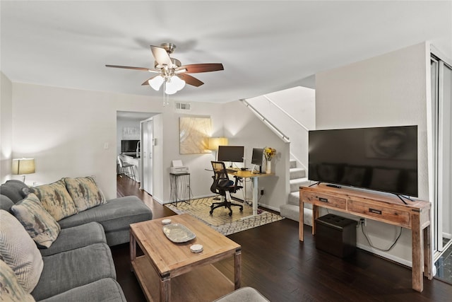 living room with dark hardwood / wood-style floors and ceiling fan