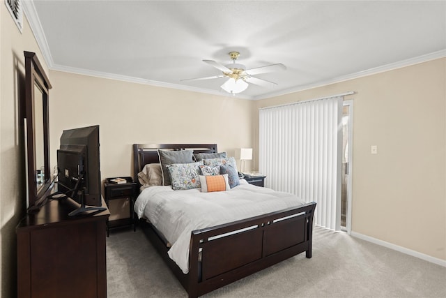 carpeted bedroom with ceiling fan and crown molding