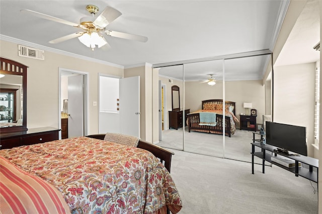 bedroom featuring light carpet, a closet, crown molding, and ceiling fan