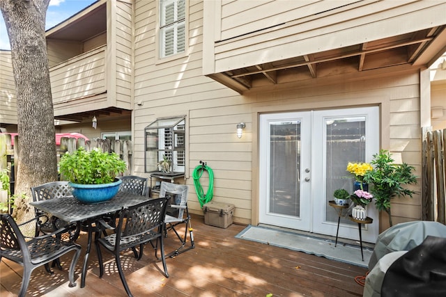 view of patio / terrace featuring area for grilling, a wooden deck, and french doors