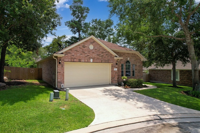 view of front of house with a front yard and a garage