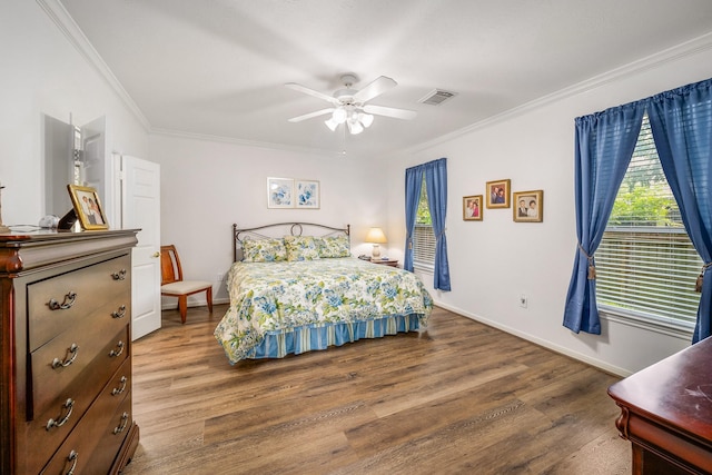 bedroom featuring wood-type flooring, ceiling fan, and ornamental molding