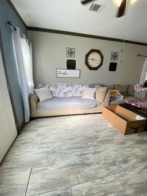 living room with ceiling fan and crown molding