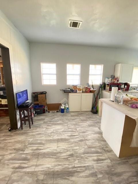 interior space featuring white cabinets