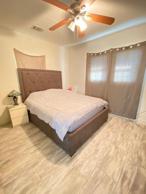 bedroom featuring ceiling fan