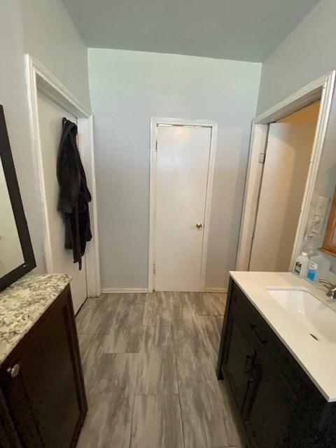 bathroom featuring vanity and hardwood / wood-style flooring