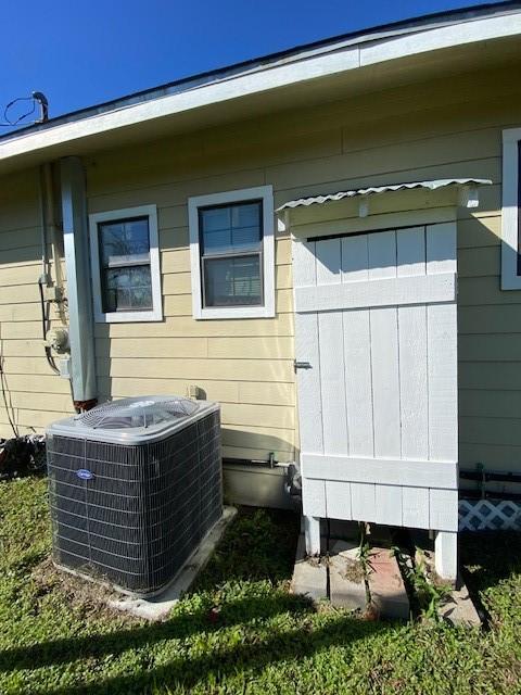 view of side of home with cooling unit