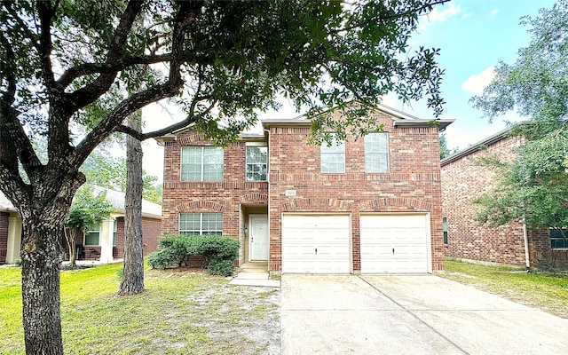 view of front facade with a front yard and a garage