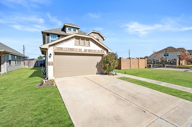 view of front of house featuring a front yard and a garage