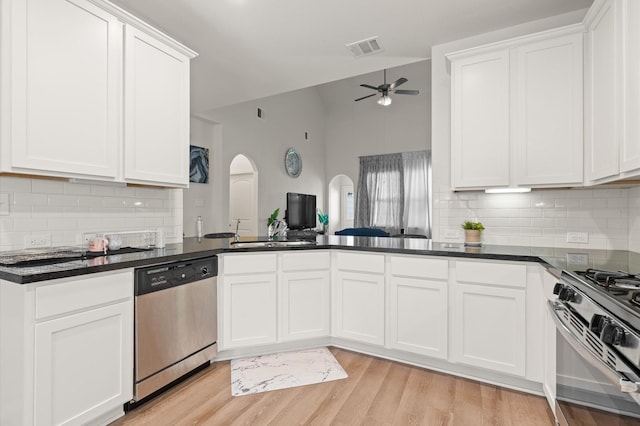 kitchen with ceiling fan, white cabinetry, and stainless steel appliances