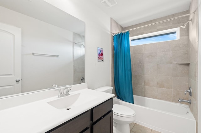 full bathroom featuring vanity, toilet, shower / bath combo with shower curtain, and tile patterned flooring