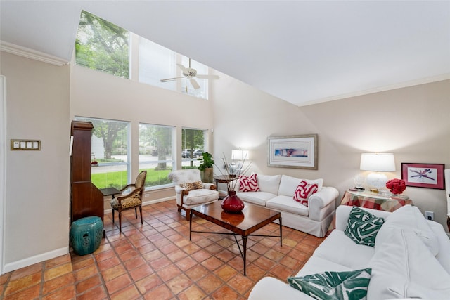 living room featuring ceiling fan and crown molding