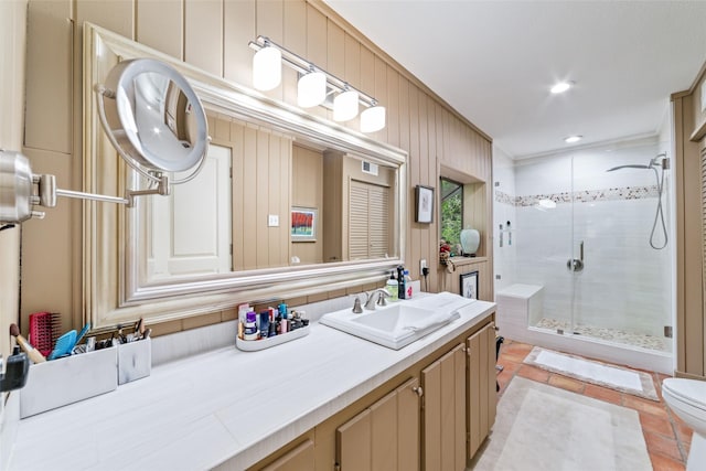 bathroom with vanity, toilet, an enclosed shower, and wooden walls