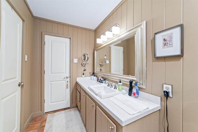 bathroom featuring vanity and ornamental molding