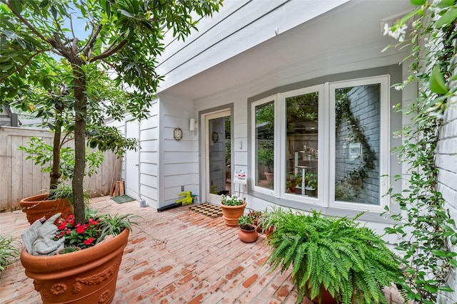 wooden terrace featuring a patio area